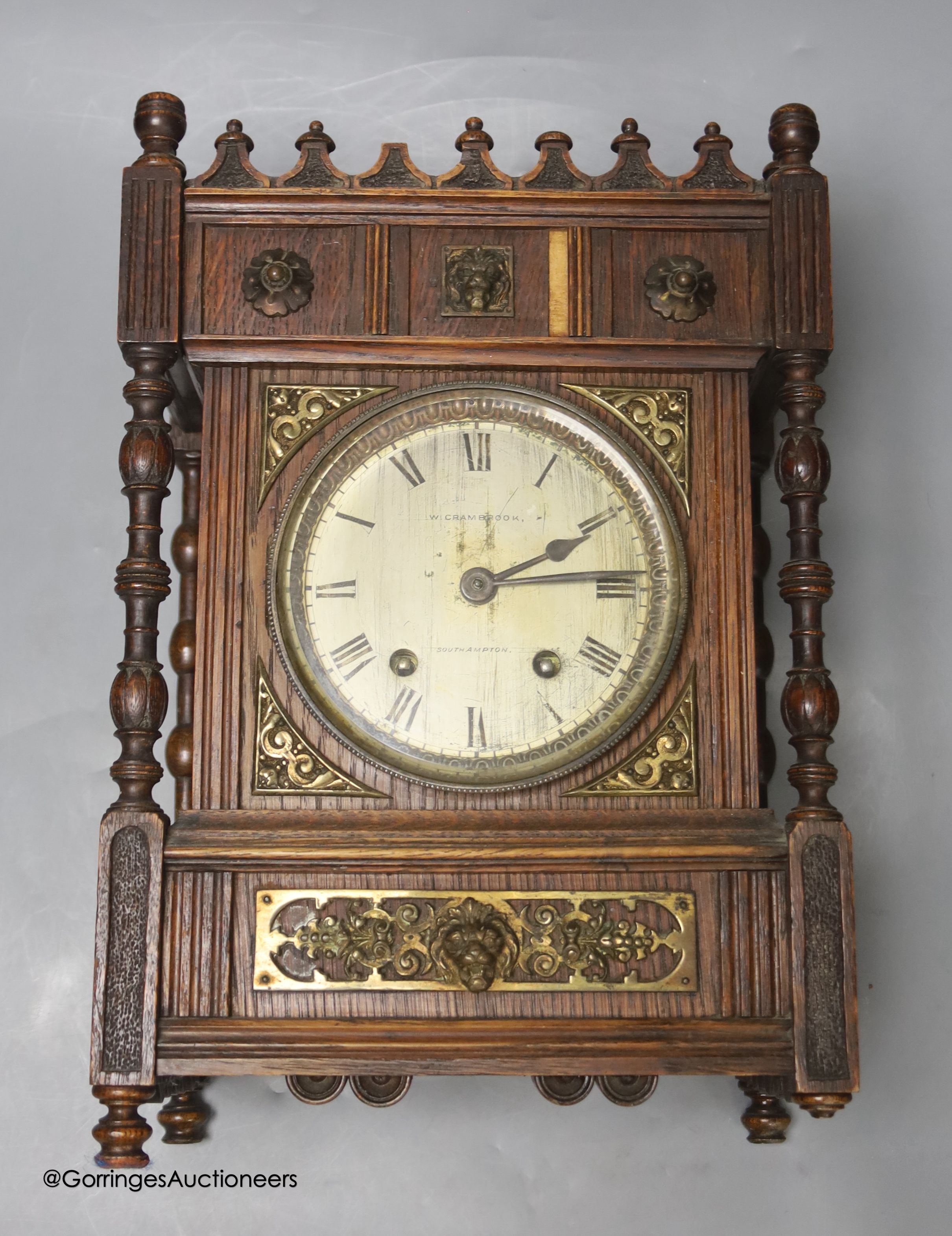 A late 19th century oak mantel clock, retailed by Crambrook of Southampton height 33cm